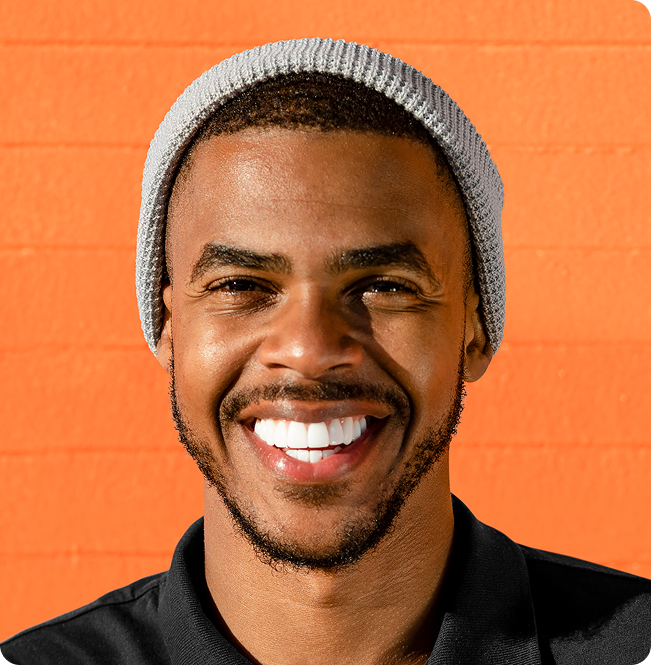 A student smiling, ready to launch their career
